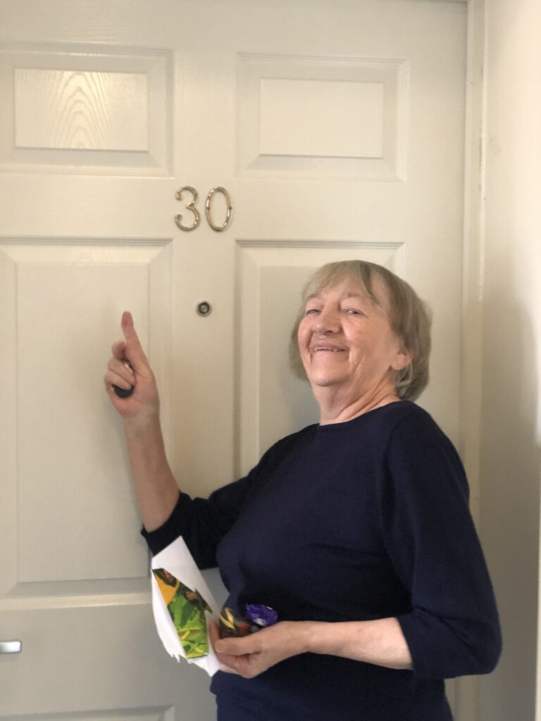 Betty proud of her new appartment